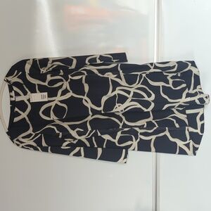 COS Voluminous A-Line Dress with a navy and off-white abstract print